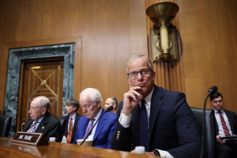 Senate Majority Leader John Thune, right, attends a Senate Finance Committee hearing on Capitol Hill on July 30, 2026.