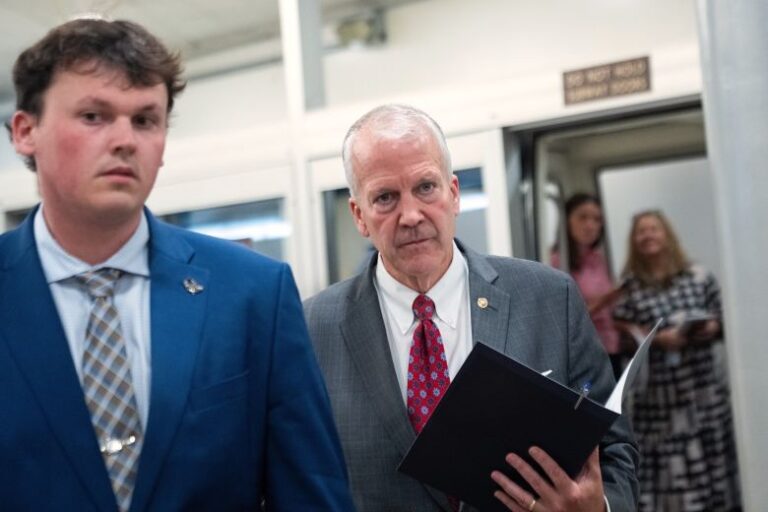 Sen. Dan Sullivan on walks through the US Capitol on July 16.