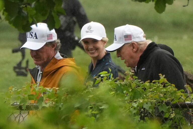 White House aide Natalie Harp, center, accompanies President Donald Trump and Interior Secretary Doug Burgum during a tour of the East Potomac Park golf course, in Washington, DC, on June 28.