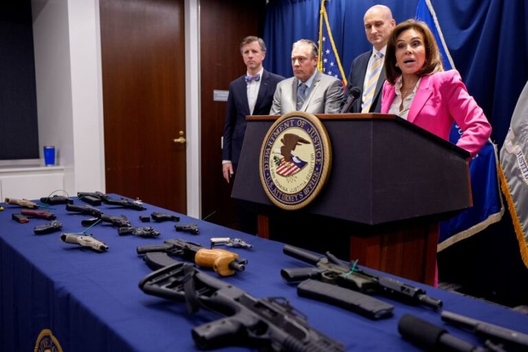 Seized guns are displayed as US Attorney for the District of Columbia Jeanine Pirro speaks during a news conference on August 26, 2025 in Washington, DC. Multiple firearms were on display during a news conference to announce a take down of a DC fentanyl and PCP drug trafficking crew.
