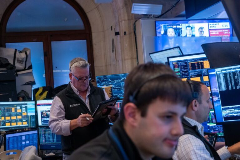 Traders work on the floor of the New York Stock Exchange (NYSE) on July 23 in New York City.