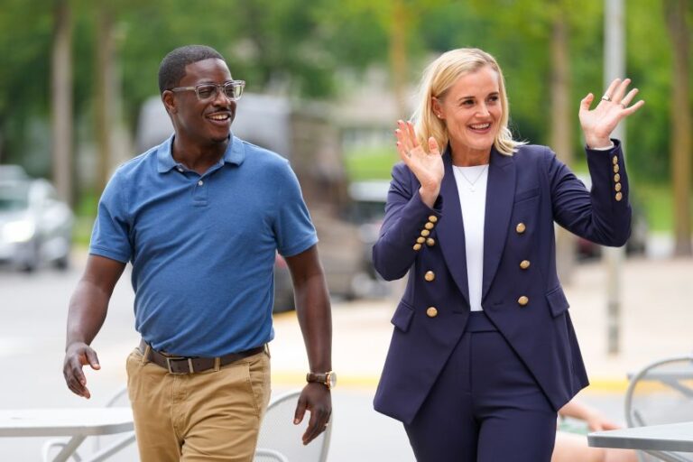 Crowley, left, and Democratic nominee for lieutenant governor Sarah Godlewski wave to supporters in Middleton, Wisconsin, on Wednesday.