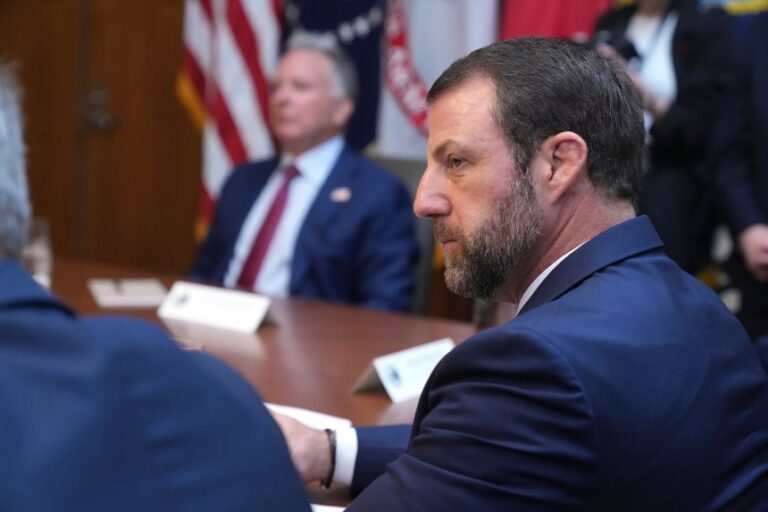 Homeland Security Secretary Markwayne Mullin listens during a cabinet meeting at Camp David in Thurmont, Maryland, on July 31.