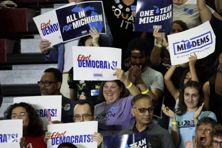 Democratic Party supporters cheer during the Michigan Democratic Party General Election Kickoff Rally at Renaissance High School in Detroit, Michigan, on August 7.