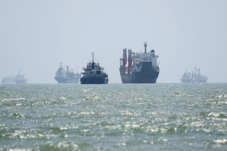 Vessels in the Strait of Hormuz are visible near the beach of Bandar Abbas, Iran, on Tuesday, August 25.