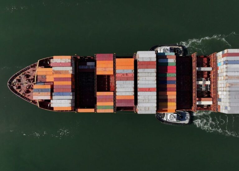 In an aerial view, a container ship arrives at the Port of Oakland on August 1, 2025, in Oakland, California.