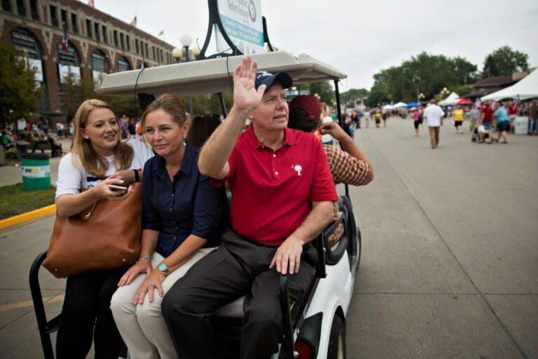 Darline Graham rides with Sen. Lindsey Graham during the Iowa State Fair in Des Moines, Iowa, in August 2015.