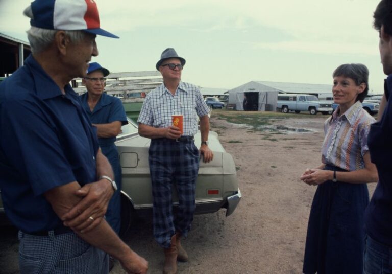 American politician Nancy Kassebaum speaking with a group of men during her campaign for the Republican nomination for the US Senate in Maize, Kansas, August 1978.