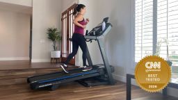 Woman running on a Horizon 7.0 AT treadmill