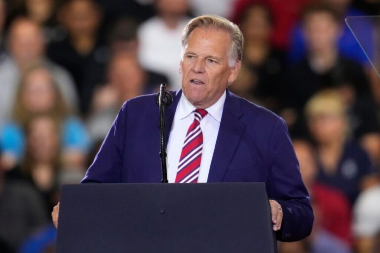 Mike Rogers speaks before President Donald Trump at an event at the General Motors Proving Ground in Milford, Michigan, on July 27.