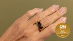 Person's hand with Oura ring on the middle finger.