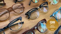 Over six online prescription glasses on a table.