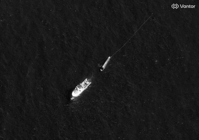 A satellite image taken on August 3 shows the Normand Ranger and SpaceX's Starship rocket. Attached to the nose of Starship is a long line.