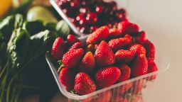 Healthy food clean eating. Fresh greens, berries and vegetable. Healthy food.