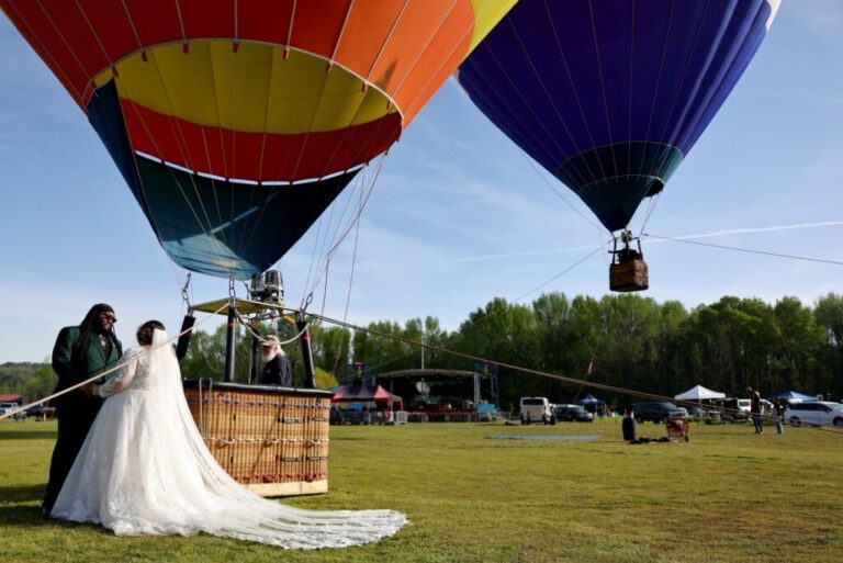 Kylee and Michael Rice prepare to take a hot air balloon ride before the <a href=