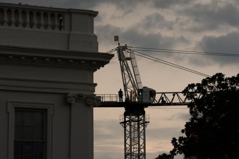 A worker on a construction crane outside the White House on July 28, 2026.