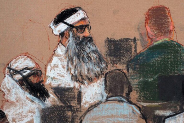 A December 8, 2008, courtroom drawing by artist Janet Hamlin and reviewed by the US military, shows Khalid Sheikh Mohammed, center, and co-defendant Walid Bin Attash, left, attending a pre-trial session at Guantanamo Bay Naval Base, Cuba.
