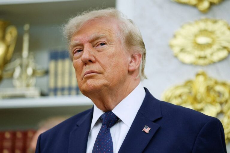 President Donald Trump attends an event in the Oval Office of the White House, in July.