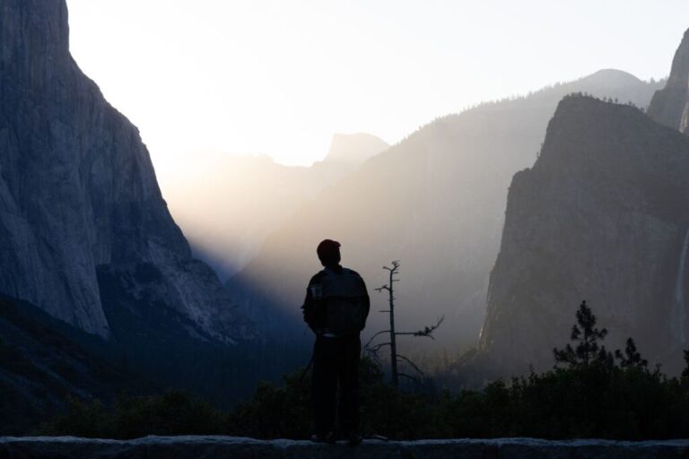 A tourist stands in front of the valley overlook during sunrise in California's Yosemite National Park, on June 12.