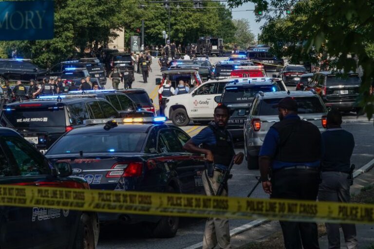 Law enforcement officers gather at CDC headquarters on August 8, 2025.