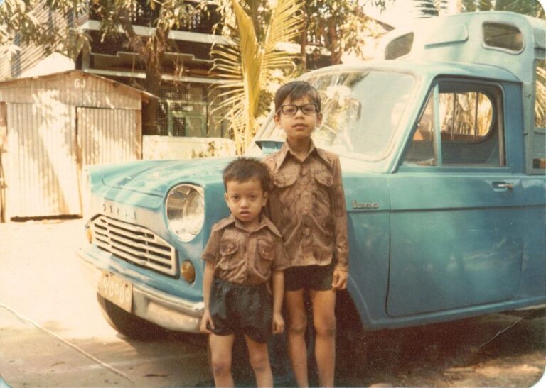 Min Zin (right), an American classified as wrongfully detained in China, is seen in this undated handout photograph.