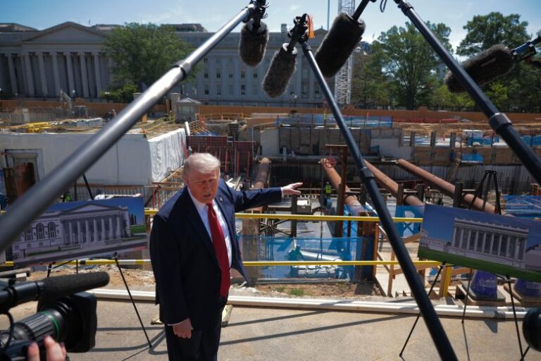 President Donald Trump talks to reporters about his proposed White House ballroom next to the worksite on May 19, in Washington, DC.