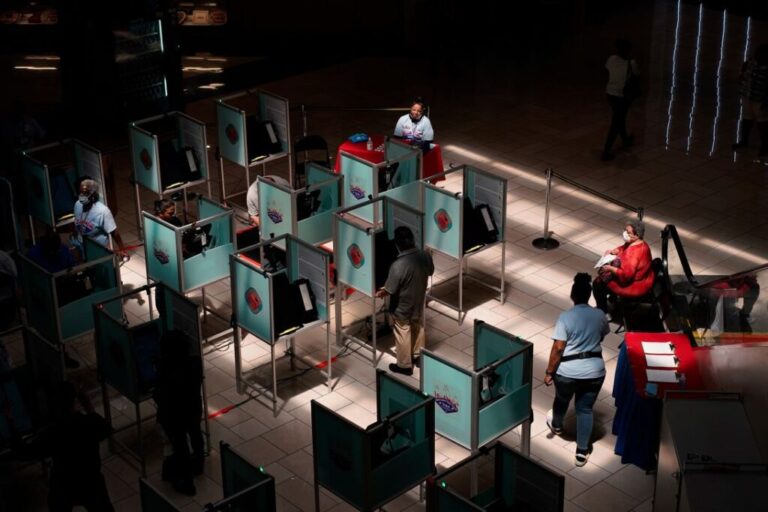 Workers and voters are pictured at a polling place in Las Vegas, in June 2022.