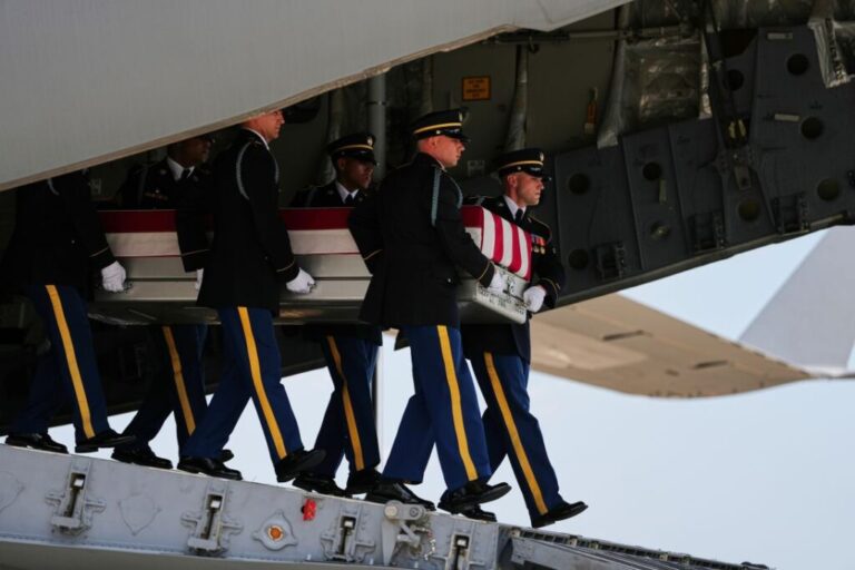 A US Army carry team moves a transfer case containing the remains of 1st Lt. Tyler James Feehan of Ewa Beach, Hawaii, one of <a href=