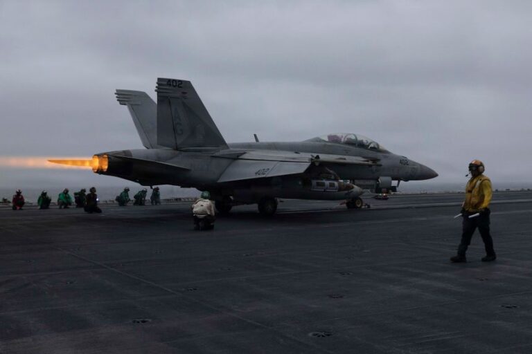 An F/A-18E Super Hornet launches off the flight deck of the USS George HW Bush, in the US 5th Fleet area of operations, which includes the Persian Gulf and Arabian Sea, on July 15, 2026.