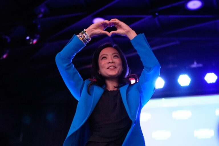 Hong makes a heart gesture to supporters after speaking during her primary election night watch party in Madison, Wisconsin, on Tuesday.