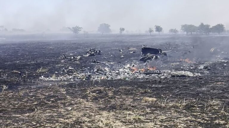 Smoke can be seein rising from debris at the scene of a military helicopter crash near Salado, Texas, on Wednesday, August 12.