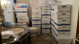 This photo from the US Justice Department shows boxes of classified documents stored in a bathroom and shower in the Mar-a-Lago Club.