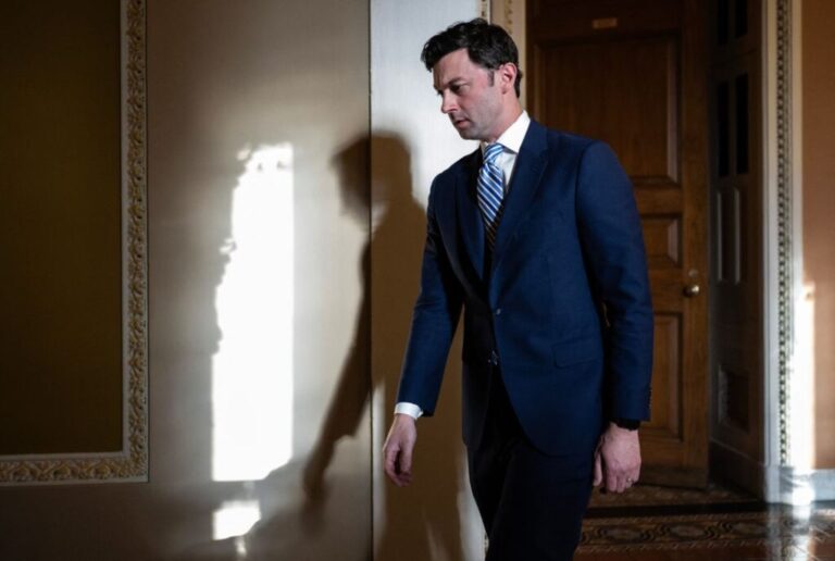 Sen. Jon Ossoff leaves a caucus meeting with Senate Democrats on Capitol Hill on September 30, 2023.