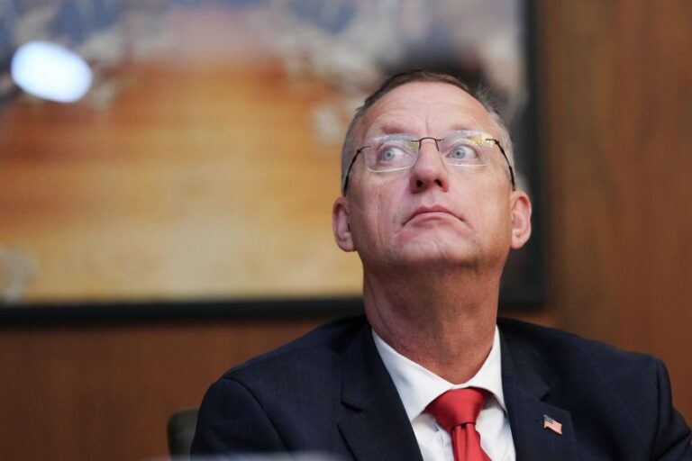 Secretary for Veterans Affairs Doug Collins looks on as President Donald Trump speaks during a Cabinet meeting at Camp David in Maryland, on July 31.