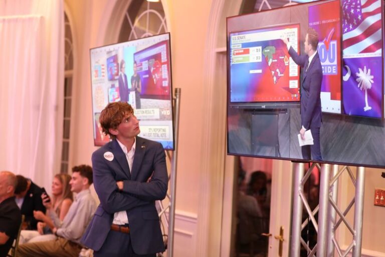 A supporter of Rep. Ralph Norman watches coverage of the special US Senate runoff, in Rock Hill, South Carolina, on Tuesday.