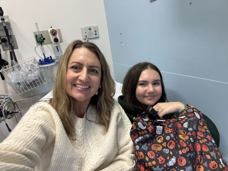 Sabina McMahon shares a light moment with her mother, Kate McMahon, during a hospital stay in 2024.