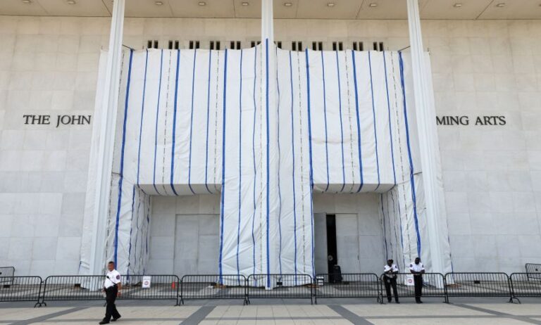 Security keeps watch at the main entrance to the John F. Kennedy Center for the Performing Arts on a day when the center's board voted to inscribe onto the building “Restored and Renovated by President Donald J. Trump”, in Washington, DC, on August 13, 2026.