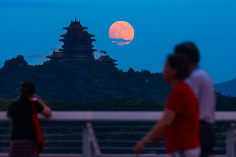 The moon rises in the sky on night of the Mid-Autumn Festival in September 2024 in Nanjing, in China's Jiangsu province.
