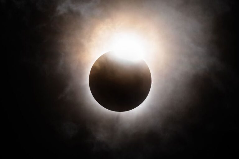 The moon begins its descent below the sun's horizon during a total solar eclipse in April 2024 in Brady, Texas.