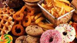 Unhealthy products. food bad for figure, skin, heart and teeth. Assortment of fast carbohydrates food with fries and cola