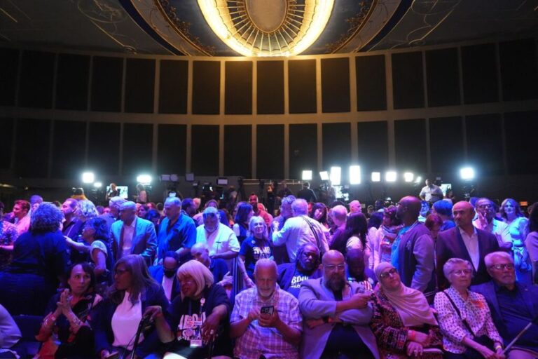 Attendees wait for election results during a primary election night event for Abdul El-Sayed in Detroit, Michigan, on August 4, 2026.