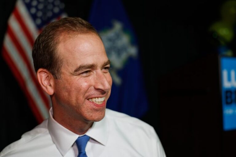 Luke Bronin, former Hartford mayor and Democratic candidate for Connecticut's 1st congressional district, smiles during an election night watch party in Hartford, Connecticut, Aug. 11, 2026.