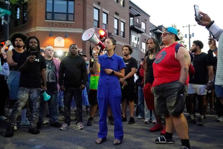 Francesca Hong speaks alongside protesters in Madison, Wisconsin, on July 22, near where a Madison police officer shot and killed a man.