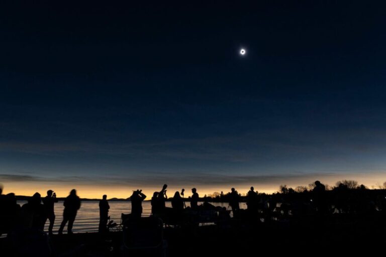 The moon covers the sun during the eclipse in Magog, Quebec.