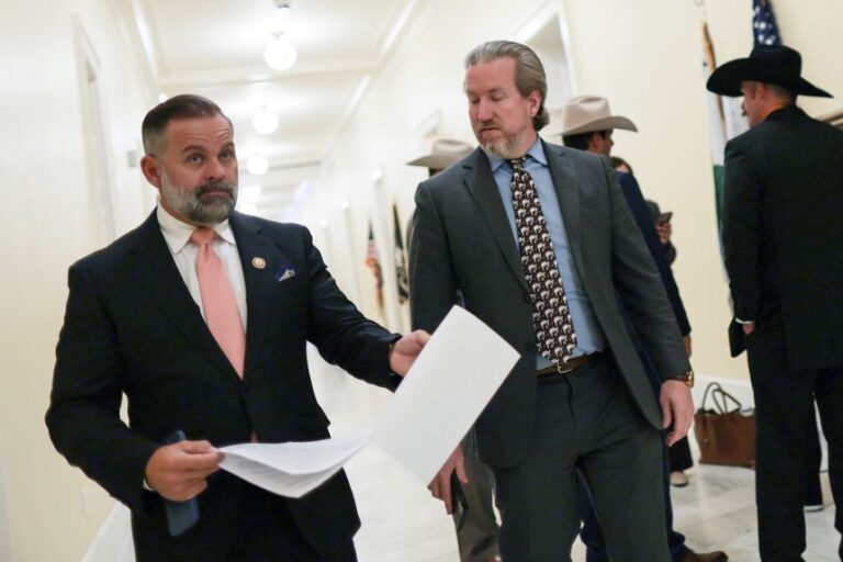 Rep. Cory Mills walks with an aide near his office on Capitol Hill, on April 22.