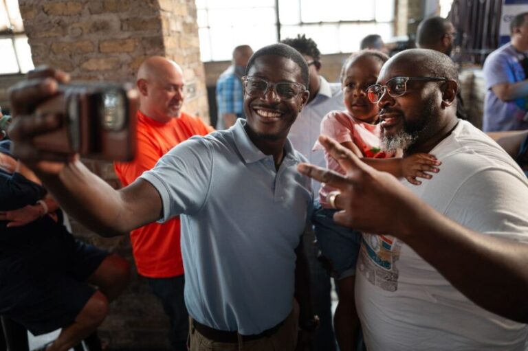 Democratic Wisconsin gubernatorial candidate David Crowley, left, greets supporters at a campaign rally on August 10, in Milwaukee, Wisconsin.
