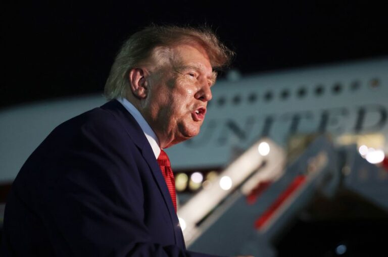 President Donald Trump speaks to reporters after stepping off Air Force One at Joint Base Andrews, Maryland, on August 11.
