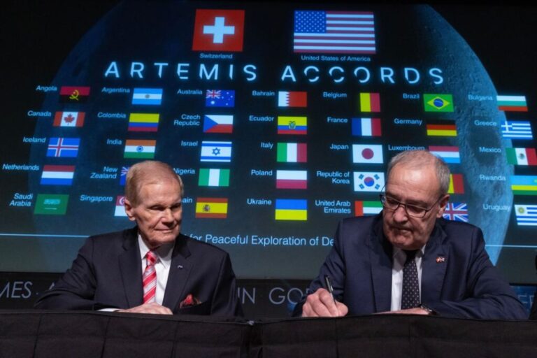 Swiss Federal Councillor Guy Parmelin (right) signs the Artemis Accords beside then-NASA Administrator Bill Nelson during a ceremony at NASA headquarters in Washington, DC, in 2024.