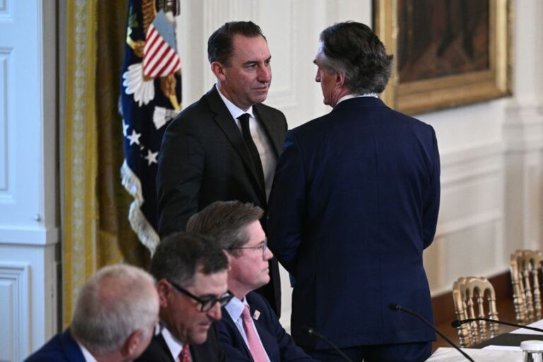 Jarrod Agen speaks with Secretary of the Interior Doug Burgum prior to the start of a meeting with US President Trump and US oil companies executives in the East Room of the White House in Washington, DC on January 9.