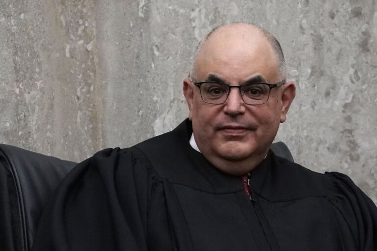 US District Judge Rudolph Contreras listens during a ceremony on April 13, 2018 at the US District Court in Washington, DC.
